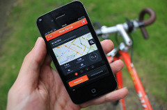 Strava user with bike and smartphone
