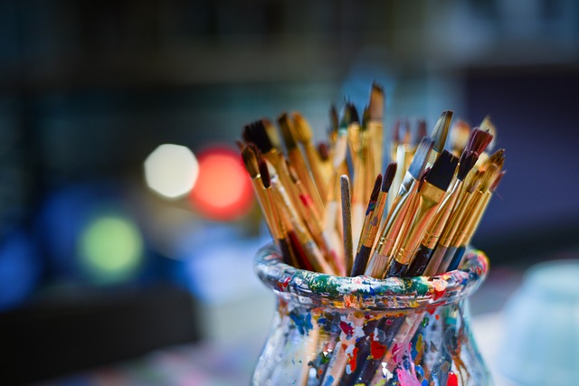 Paint brushes in colourful pot