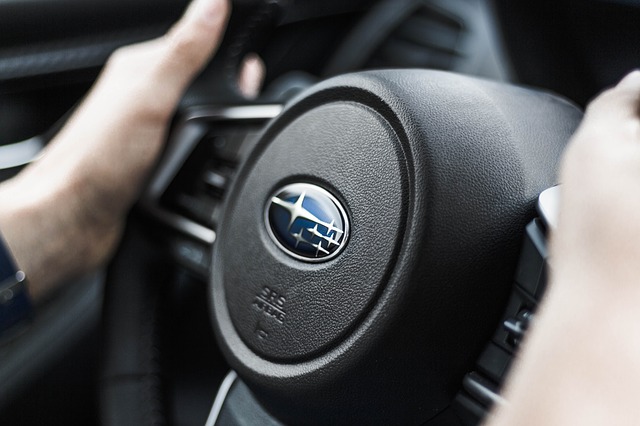 Subaru steering wheel and driver's hands