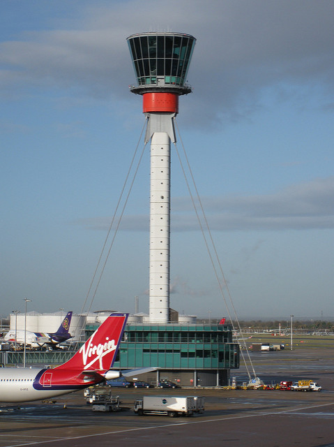 Airport control tower and Virgin Atlantic plane